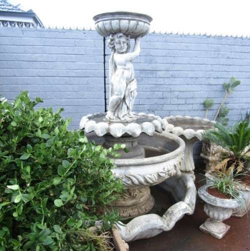 A fabulous, large three tier cherub water fountain. Stunning as a feature piece in a garden!!!