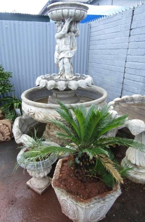 A fabulous, large three tier cherub water fountain. Stunning as a feature piece in a garden!!!