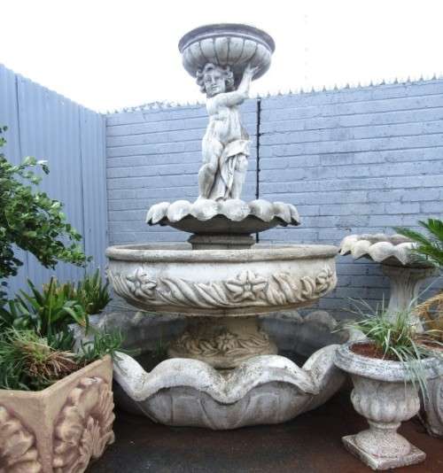 A fabulous, large three tier cherub water fountain. Stunning as a feature piece in a garden!!!