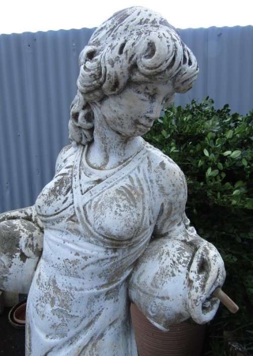 A pretty concrete free standing water feature statue of a lady. Stunning in a fountain or garden!