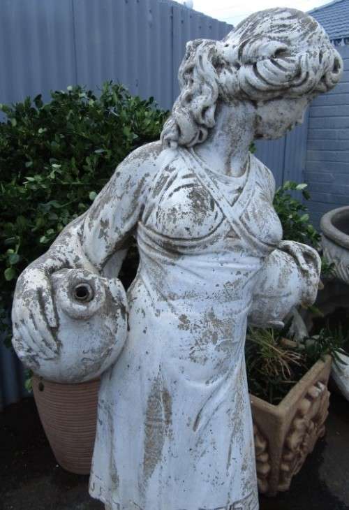A pretty concrete free standing water feature statue of a lady. Stunning in a fountain or garden!