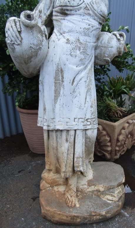 A pretty concrete free standing water feature statue of a lady. Stunning in a fountain or garden!