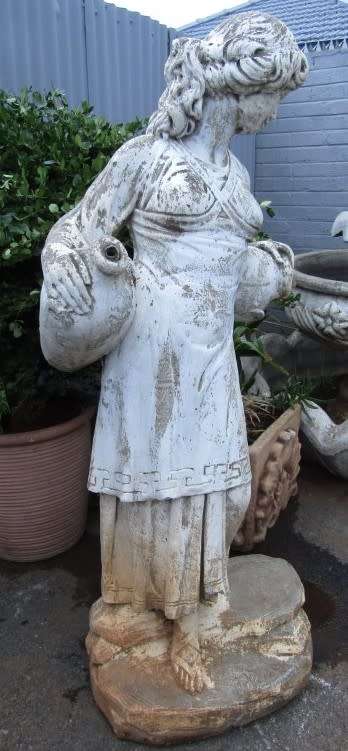 A pretty concrete free standing water feature statue of a lady. Stunning in a fountain or garden!