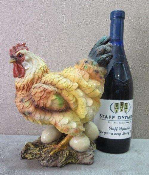 A wonderful little plastic figurine of a hen surrounded by eggs, fabulous on display.