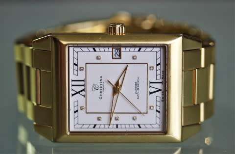 A good-looking original Christina London gold plated Swiss made diamond wrist watch.