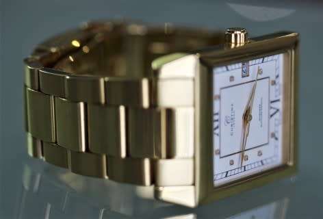 A good-looking original Christina London gold plated Swiss made diamond wrist watch.