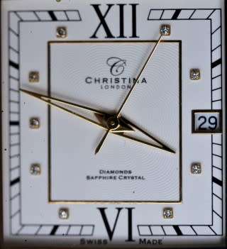 A good-looking original Christina London gold plated Swiss made diamond wrist watch.