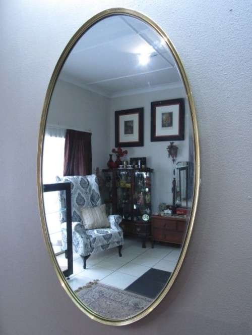 A fantastic large oval solid brass wall mirror (62cm x 100cm) can be hung both ways.