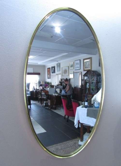 A fantastic large oval solid brass wall mirror (62cm x 100cm) can be hung both ways.