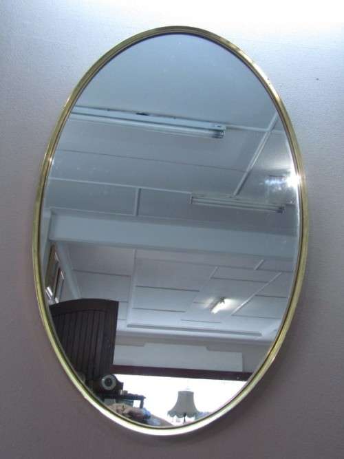 A fantastic large oval solid brass wall mirror (62cm x 100cm) can be hung both ways.
