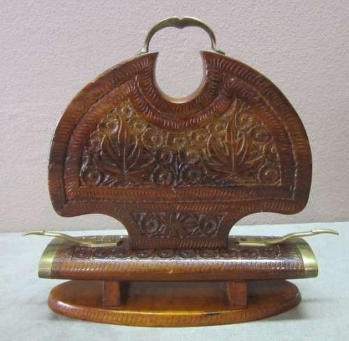 An awesome collectible hand carved Indian knife and fork carving set in a wood stand w/ brass trim