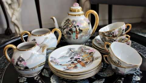 A stunning oriental porcelain tea set of four trio's including a tea pot, milk jug & sugar pot!