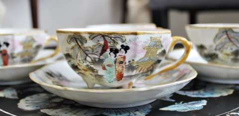 A stunning oriental porcelain tea set of four trio's including a tea pot, milk jug & sugar pot!