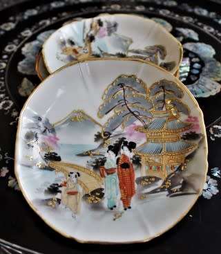 A stunning oriental porcelain tea set of four trio's including a tea pot, milk jug & sugar pot!