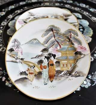 A stunning oriental porcelain tea set of four trio's including a tea pot, milk jug & sugar pot!