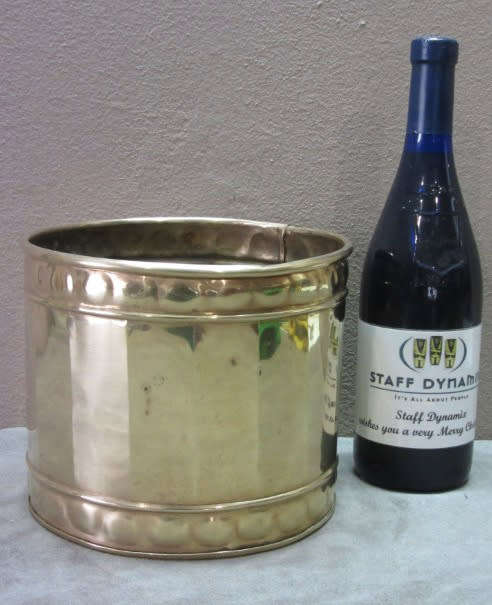A solid brass pot planter with punched detailing. Gorgeous in all living areas! Lifespace Sale