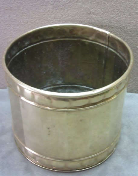 A solid brass pot planter with punched detailing. Gorgeous in all living areas! Lifespace Sale