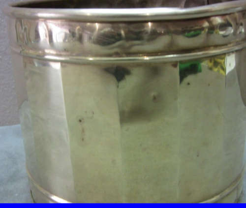 A solid brass pot planter with punched detailing. Gorgeous in all living areas! Lifespace Sale