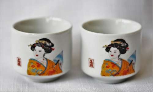 An awesome pair of ceramic rice wine cups, with an image of a woman on them. Lifespace Sale