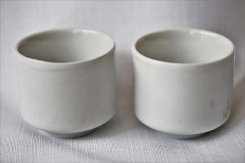 An awesome pair of ceramic rice wine cups, with an image of a woman on them. Lifespace Sale