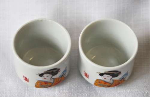 An awesome pair of ceramic rice wine cups, with an image of a woman on them. Lifespace Sale