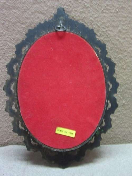 A lovely oval framed silk tapestry of a woman and a dog, made in Italy. Gorgeous!