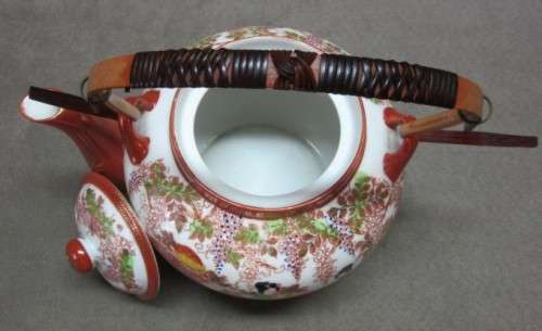 A gorgeous traditional oriental tea pot. Stunning in a kitchen cabinet!