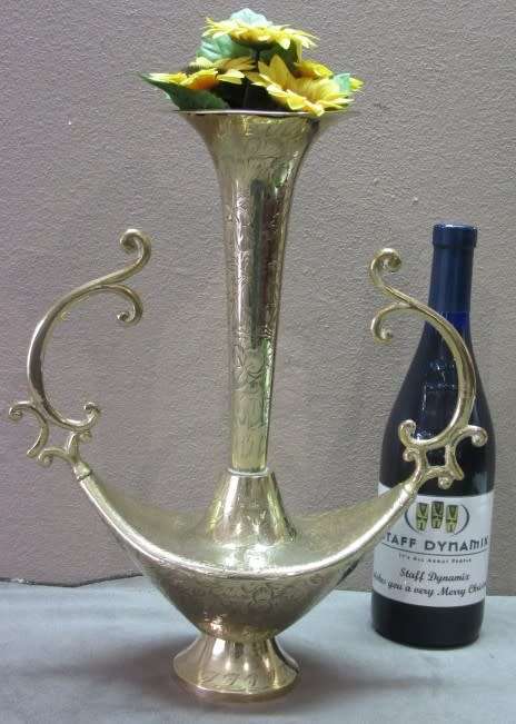 A lovely solid brass vase with two handles. Beautiful on display! Lifespace Sale