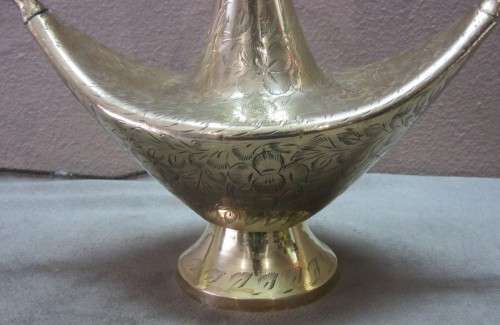 A lovely solid brass vase with two handles. Beautiful on display! Lifespace Sale