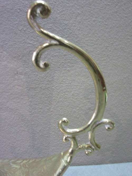 A lovely solid brass vase with two handles. Beautiful on display! Lifespace Sale