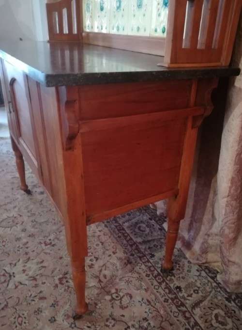 A wonderful vintage solid Oak single door wash stand with a black marble top on castors - stunning!!