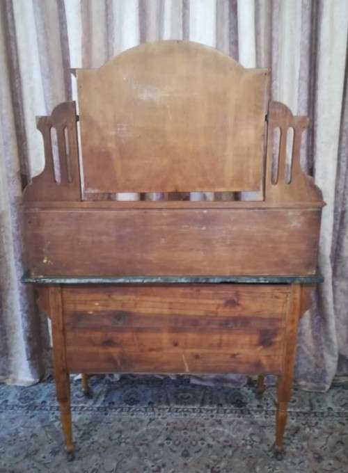 A wonderful vintage solid Oak single door wash stand with a black marble top on castors - stunning!!