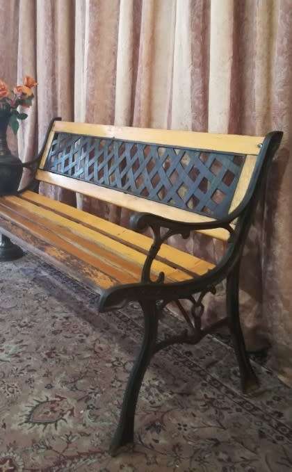 A fabulous wood and wrought iron slatted wood all weather garden/ patio bench. Perfect outdoor bench
