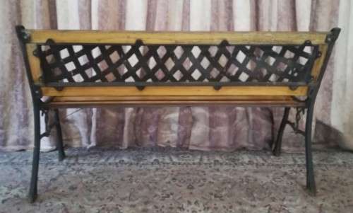 A fabulous wood and wrought iron slatted wood all weather garden/ patio bench. Perfect outdoor bench