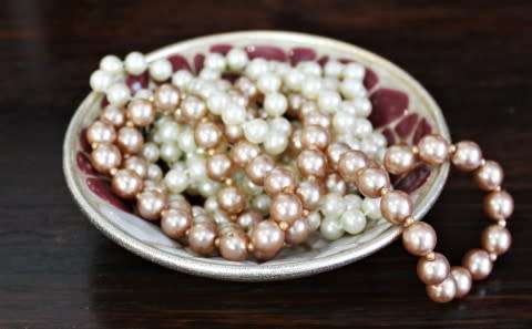 A stunning rose-gold coloured metal & mosaic decorated trinket bowl. Lifespace Sale