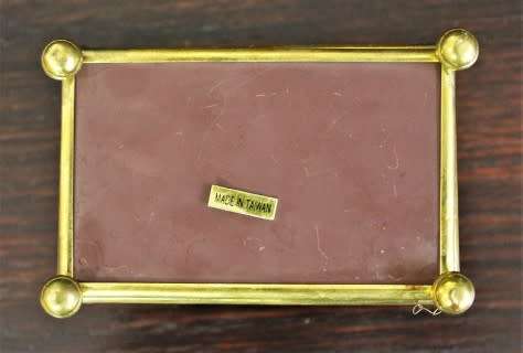 A charming coloured glass trinket box with a gold-coloured frame and mirror base. Lifespace Sale