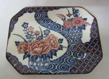 A gorgeous pair of hand painted Japanese "Imari" decorative porcelain wall plates.