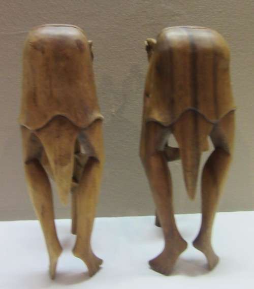 A lovely pair of Balinese carvings of men playing a flute. Great on display.