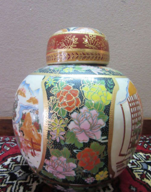 A gorgeous, colourful decorated Japanese Ginger jar with gold gilt on.