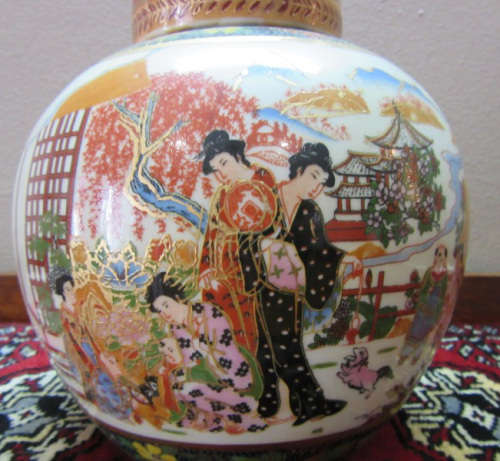 A gorgeous, colourful decorated Japanese Ginger jar with gold gilt on.