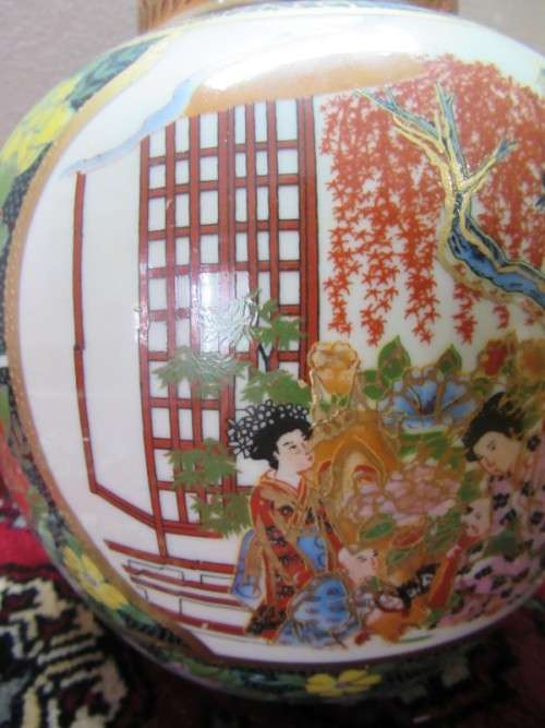A gorgeous, colourful decorated Japanese Ginger jar with gold gilt on.