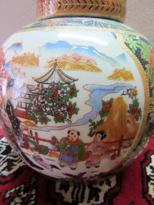 A gorgeous, colourful decorated Japanese Ginger jar with gold gilt on.