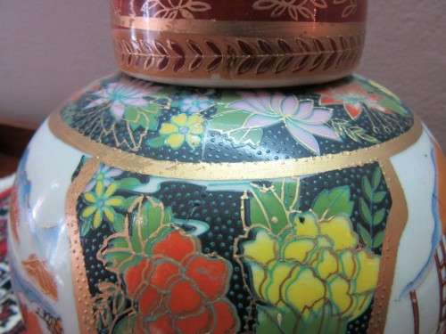 A gorgeous, colourful decorated Japanese Ginger jar with gold gilt on.