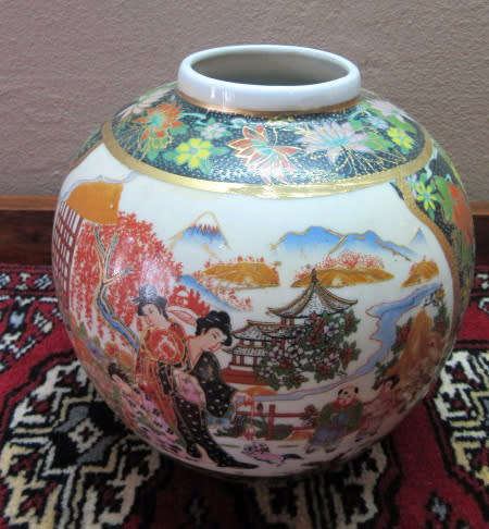 A gorgeous, colourful decorated Japanese Ginger jar with gold gilt on.