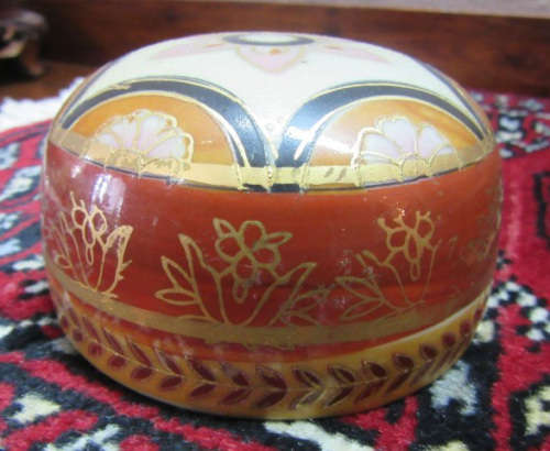 A gorgeous, colourful decorated Japanese Ginger jar with gold gilt on.