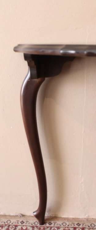 A stylish vintage Imbuia scalloped edge half moon display/ occasional table.