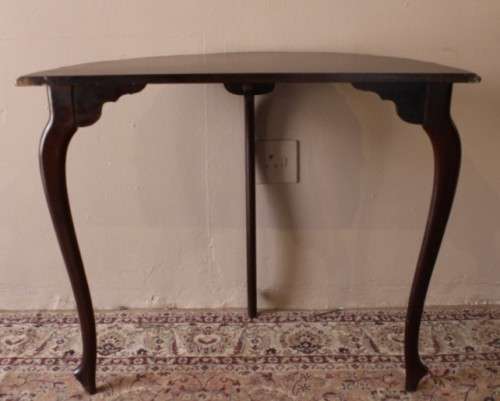A stylish vintage Imbuia scalloped edge half moon display/ occasional table.