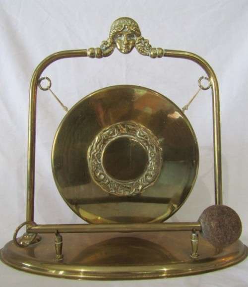 A stunning vintage brass dinner gong on a stand with a mallet, lovely on display or for use!