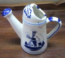 A wonderful small vintage porcelain watering can, great on display. Lifespace Sale