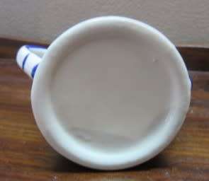 A wonderful small vintage porcelain watering can, great on display. Lifespace Sale